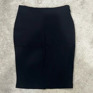 Black midi pencil skirt. Never worn, size L.